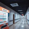 Hospital coffee vending machines in a clean hospital corridor with multiple beverage options