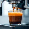 Espresso machine brewing rich coffee shot with crema for best espresso machines for office use