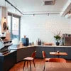 Modern cafe interior with best coffee machines for new cafes and seating area