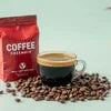 Coffee premix brand with coffee cup and scattered coffee beans