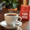 Cafe Desire Coffee Premix pouch with steaming cup of coffee for office and cafe vending