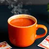 Instant Tomato Soup Powder cup steaming ready for office and cafe vending