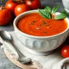 Tomato soup actually healthy bowl with fresh tomatoes and basil for nutritious meal