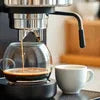 Nescafe coffee machine brewing fresh coffee for office use