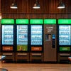 Modern office coffee vending machine with multiple coffee options and refrigerated display for office use