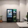 Atlantis Cafe Mini tea coffee machine for small offices with black vending machine in office lounge