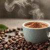 Continental Coffee Powder in cup with steam and coffee beans for office and cafe vending