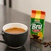 Bru Hot Coffee packet with cup of brewed coffee for office and cafe vending