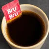 Bru Hot Coffee Premix single sachet with brewed coffee for office or cafe vending