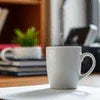 Continental Instant Coffee Regular Blend white mug on office desk for coffee break
