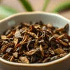 Close-up of loose coffee grounds in a white bowl for Atlantis Coffee Machine 4 Lane use