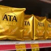 TATA Tea Gold 500g gold packaging displayed on store shelf with price tag for vending and office use