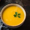 Bowl of yellow Atlantis Sweet Corn Soup PremiX ready to serve for office or vending use
