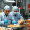 Instant soup premix supplier Noida workers packaging orange soup mix in factory for vending use