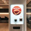 NESCAFÉ Atlantis coffee machine near me in white for office use with cup dispenser