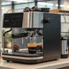 Atlantis coffee machine Ghaziabad black and silver compact model for office use brewing espresso