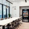 Office Coffee Vending Machine Delhi with black brand vending machine in modern office meeting room