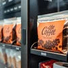 Orange brand Coffee Vending Powder Wholesaler Delhi packets displayed in vending machine for office use