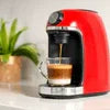 Red Nespresso coffee machine rental model brewing espresso for office use on counter