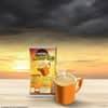 Sunrise coffee premix for vending machines 1 kg pack with cup of coffee on wooden table at sunrise