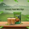 Brand green pack of instant cardamom tea premix online with two cups of cardamom tea on wooden table for office use