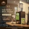 Atlantis Coffee Premix Plus vending machine with green and black design in office kitchen