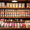 Amazon Plus tea premix shop Faridabad display shelves with various colorful packaged tea premix brands and sizes for vending and office use