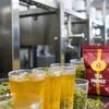 Amazon Plus tea premix supplier Delhi branded premix packets with ready-to-serve tea glasses in factory setup