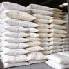 Stacked white sacks of tea powder from Amazon Plus tea powder supplier in Gurgaon for office use