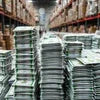 Stacks of packaged instant tea wholesale suppliers Delhi NCR products in a large warehouse storage
