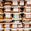 Amazon Plus tea premix supplier Greater Noida displaying multiple labeled tea premix packets in brown packaging for vending and office use
