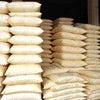Stacks of Atlantis coffee powder distributor Gorakhpur brand bags in beige and white packaging for office and vending use