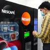 Nescafe vending machine service Gorakhpur with black Nescafe coffee vending machine in office setting