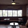 Coffee and tea premix shop near me Gorakhpur showing cozy seating area with wooden tables and large windows