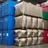 Atlantis Kadak tea large brown sacks stacked on pallets with blue and red crates in warehouse for office use