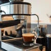 Silver Atlantis coffee machine for office India brewing espresso with clear glass cup