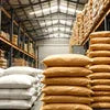 Warehouse with stacks of Atlantis premix powder distributor India bags in brown and white for industrial use
