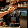 Barista preparing fresh coffee using Nescafe professional coffee premix India in a modern coffee shop