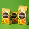 Nescafe tea premix distributor India showing Nescafe Classic tea premix packets in yellow and green for office use