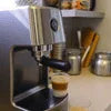 Silver and black Amazon coffee machine Varanasi brewing espresso in a home kitchen setting