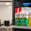 Coffee Premix Supplier Sonipat branded instant coffee premix packets in green and white packaging for office vending use