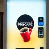 Nescafe vending machine Amritsar with white background and red coffee cup for office use
