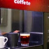 Atlantis Coffee Premix Bhavnagar in red and black vending machine cup for office use