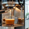 Silver espresso coffee machine brewing small cup with crema coffee in office setting Coffee Machine Supplier Nashik