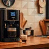 Black Amazon Coffee Machine Gwalior model on wooden kitchen counter for office use