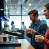 Two men using a black office coffee machine for Office Coffee Rent in a modern office setting