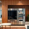 Silver coffee vending machine model with multiple selection buttons in a modern office setting for Coffee Vending Rent in Delhi