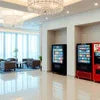 Atlantis Faridabad office vending area with snack and beverage vending machines in a clean bright lounge