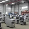 Machine Rent Ghaziabad showing multiple industrial machines in a large gray warehouse for office use
