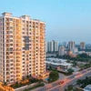 Atlantis Rent Gurgaon high-rise residential building in beige with multiple balconies and cityscape background
